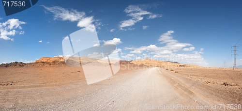 Image of Road in the desert towards the distant rocks