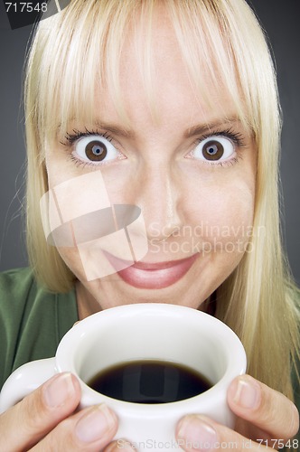 Image of Beautiful Woman Enjoys Coffee