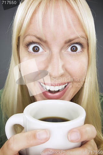 Image of Beautiful Woman Enjoys Coffee