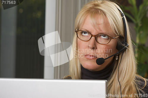 Image of Attractive Businesswoman with Phone Headset