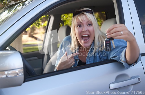 Image of Attractive Woman In New Car with Keys