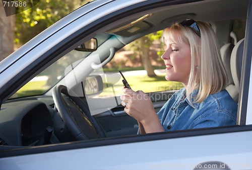 Image of Woman Text Messaging While Driving