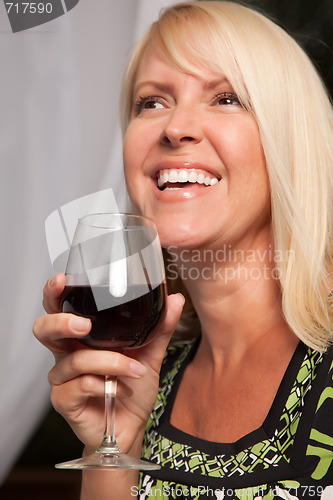 Image of Beautiful Blonde Enjoying Wine