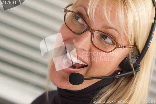 Image of Attractive Businesswoman with Phone Headset