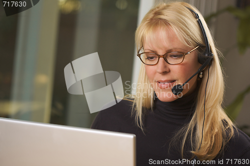 Image of Attractive Businesswoman with Phone Headset