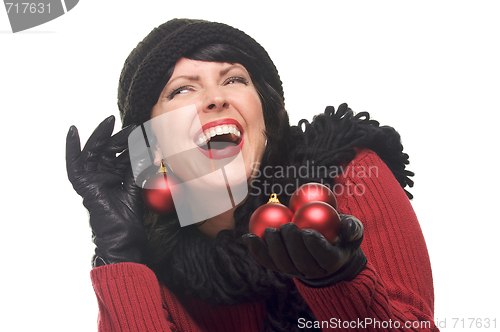 Image of Attractive Woman Holding Red Ornaments