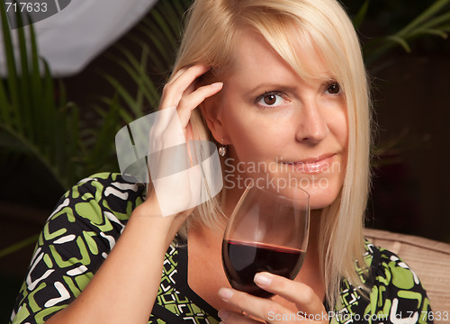 Image of Beautiful Blonde Woman Enjoying Wine