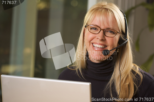 Image of Attractive Businesswoman with Phone Headset