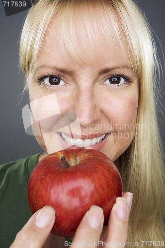 Image of Beautiful Woman With Apple