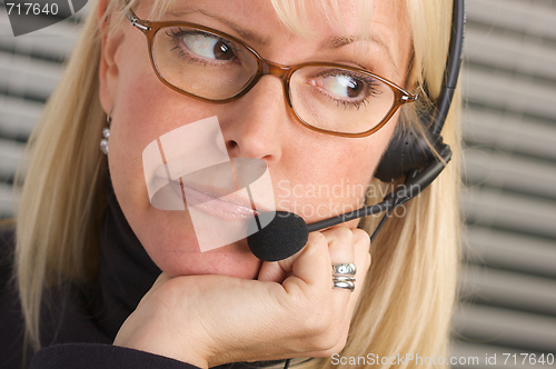 Image of Attractive Businesswoman with Phone Headset