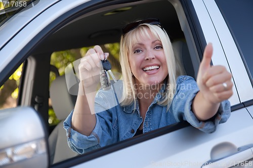 Image of Attractive Woman In New Car with Keys