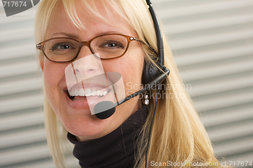 Image of Attractive Businesswoman with Phone Headset