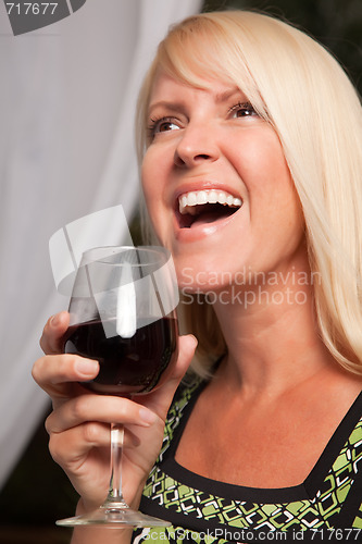 Image of Beautiful Blonde Enjoying Wine