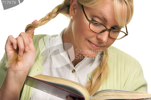 Image of Female With Ponytails Reads Her Book