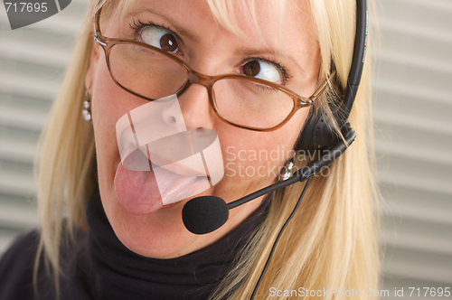 Image of Attractive Businesswoman with Phone Headset