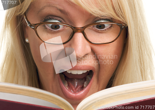 Image of Attractive Woman Taken Back While Reading 