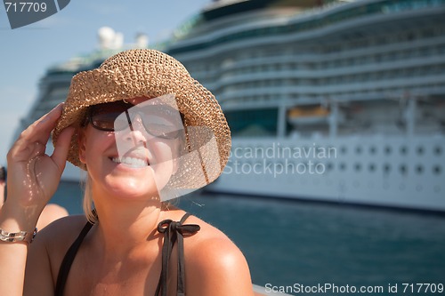 Image of Beautiful Vacationing Woman with Cruise Ship
