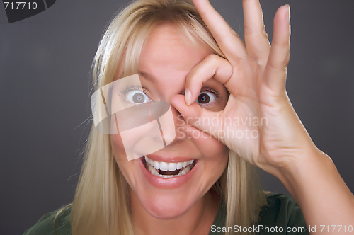 Image of Woman with Okay Sign in Front of Face