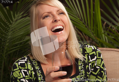 Image of Beautiful Blonde Enjoying Wine