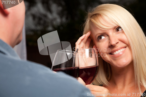 Image of Blonde Socializing with Wine Glass