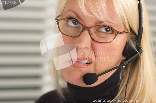 Image of Attractive Businesswoman with Phone Headset