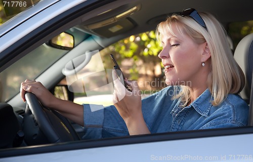 Image of Woman Text Messaging While Driving