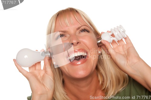 Image of Funny Woman Holding Energy Saving and Regular Light Bulbs to Her