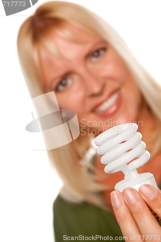 Image of Attractive Blonde Woman Holds Energy Saving Light Bulb