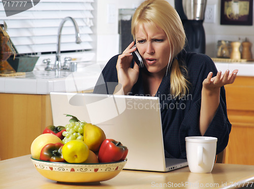 Image of Woman on Cell Phone & Laptop