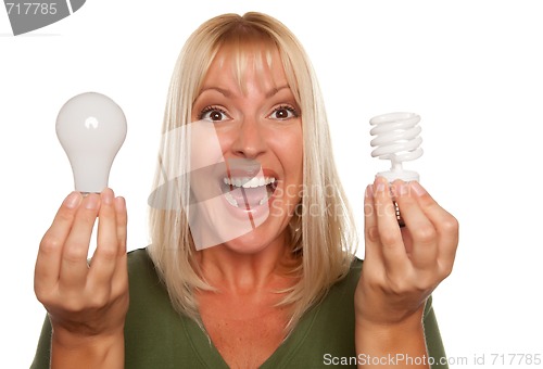 Image of Woman Holds Energy Saving and Regular Light Bulbs