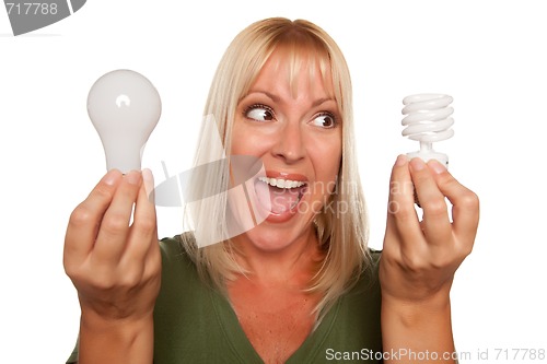 Image of Woman Holds Energy Saving and Regular Light Bulbs