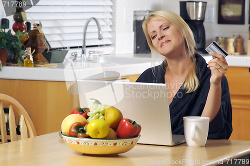 Image of Woman Using Laptop for E-commerce