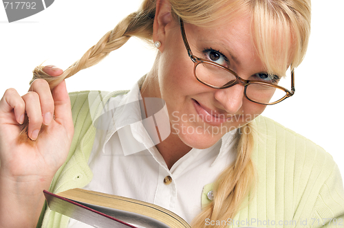 Image of Female With Ponytails Reads Her Book