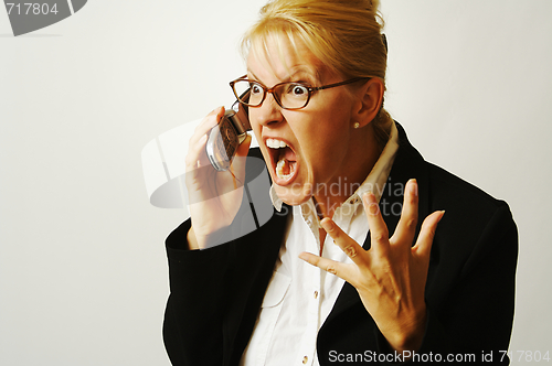 Image of Angry Business Woman on Cell Phone