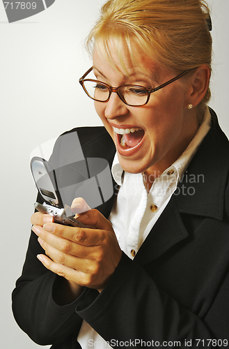 Image of Businesswoman using her cell phone.