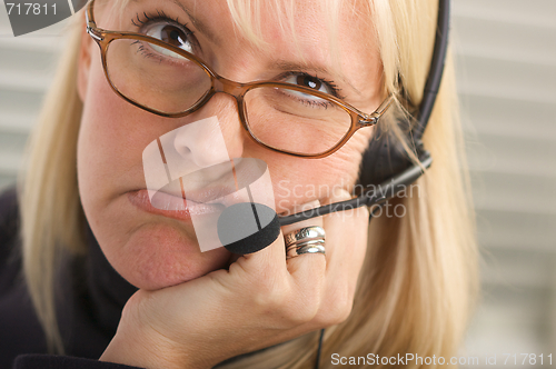 Image of Attractive Businesswoman with Phone Headset