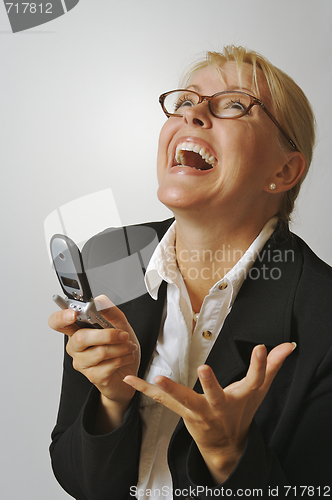 Image of Businesswoman using her cell phone.