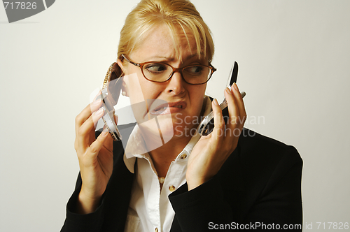 Image of Frustrated Cell Phone Businesswoman.