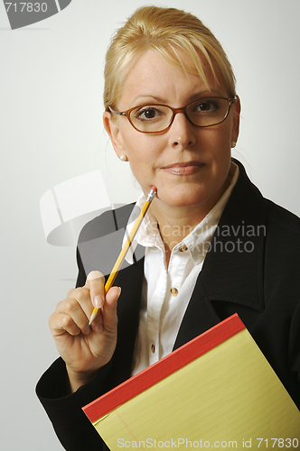 Image of Beautiful Woman Thinks with Pencil & Notepad