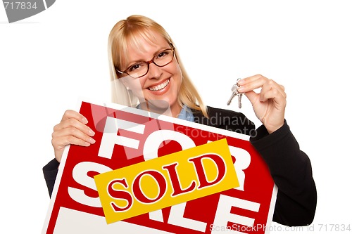 Image of Attractive Blonde Holding Keys & Sold For Sale Sign