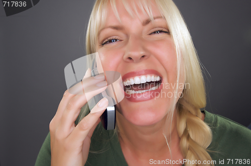 Image of Joyful Blond Woman Using Cell Phone