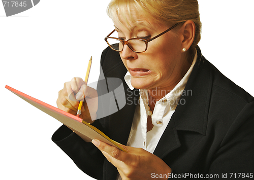 Image of Female Erases Mistake on her Notepad