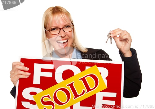 Image of Attractive Blonde Holding Keys & Sold For Sale Sign