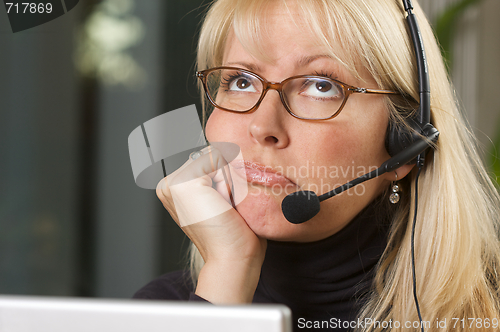 Image of Attractive Businesswoman with Phone Headset