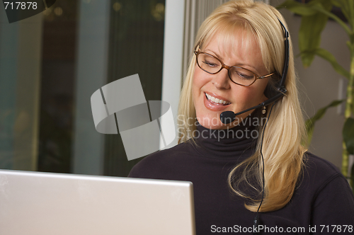 Image of Attractive Businesswoman with Phone Headset