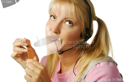 Image of An obviously bored customer support girl.