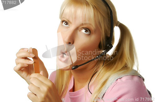 Image of An obviously bored customer support girl.