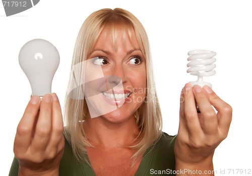 Image of Woman Holds Energy Saving and Regular Light Bulbs