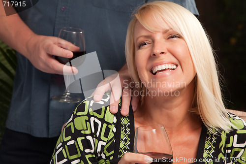 Image of Blonde Woman Socializing with Wine Glass