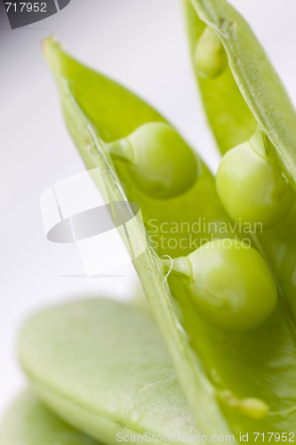 Image of fresh peas on white background